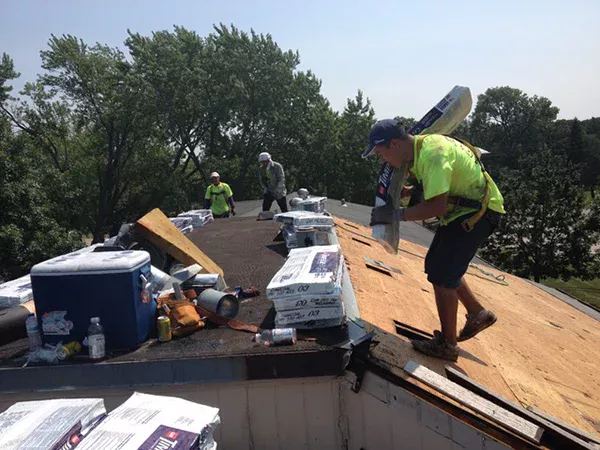 Crew getting ready to install new roof shingles